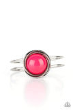 Paparazzi Take It From The POP - Pink Bracelet - An oversized Raspberry Sorbet bead is pressed into the center of overlapping silver rings that coalesce into a dizzying centerpiece atop an airy silver bangle-like cuff, creating a bold pop of color atop the wrist. Features a hinged closure.