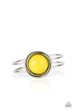 Paparazzi Take It From The POP - Yellow Bracelet - An oversized Illuminating bead is pressed into the center of overlapping silver rings that coalesce into a dizzying centerpiece atop an airy silver bangle-like cuff, creating a bold pop of color atop the wrist. Features a hinged closure.