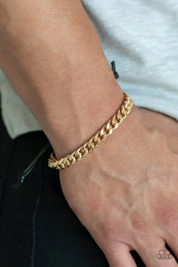 Paparazzi Throwdown - Gold Bracelet - Shiny black cording knots around the ends of a thick gold curb chain that is wrapped across the top of the wrist for a versatile look. Features an adjustable sliding knot closure.