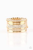 Paparazzi Top Dollar Drama - Gold Ring - Shimmery gold and white rhinestone encrusted bands stack across the finger for a glamorous look. Features a stretchy band for a flexible fit.