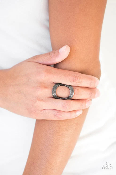 Paparazzi Tour de Contour - Black Gunmetal - Ring - Delicately hammered in shimmery textures, a glistening gunmetal frame circles atop the finger for a modern look. Features a stretchy band for a flexible fit.