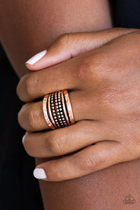 Paparazzi Trailblazin Trails - Copper Ring - Delicately hammered in shimmering detail, two copper bands flank rows of smooth and dotted bands for a collision of glistening textures. Features a stretchy band for a flexible fit.