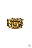 Paparazzi Treasure Trove Tribute - Brass Ring - Featuring round, emerald, and marquise style cuts, glittery aurum rhinestones stack across the finger for a glamorous shimmer. Features a stretchy band for a flexible fit.
