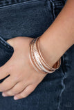 Paparazzi Trophy Texture - Rose Gold Bracelet - Featuring a polished finish, a mismatched collection of textured, braided, hammered, and plain rose gold bangles stack across the wrist for a classic metallic look.