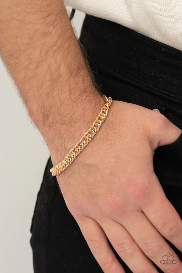 Paparazzi Very Valiant - Gold Bracelet - Featuring diamond-cut textures on one side and a smooth finish on the other, a glistening gold curb chain wraps around the wrist for a reversible versatile look. Features an adjustable clasp closure.