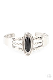 Paparazzi Wanderlust Walkabout - Black Bracelet - An oval black bead is pressed into the center of a textured silver frame atop a layered silver cuff stamped in swirly texture, resulting in a trendy pop of color around the wrist.