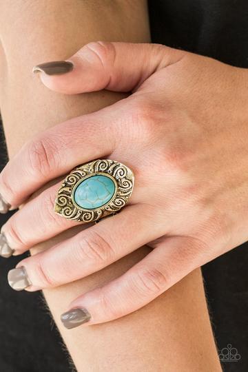 Paparazzi Mega Mother Nature - Brass A refreshing turquoise stone is pressed into a shimmery brass frame embossed in swirling details for an artisan inspired look. Features a stretchy band for a flexible fit.
