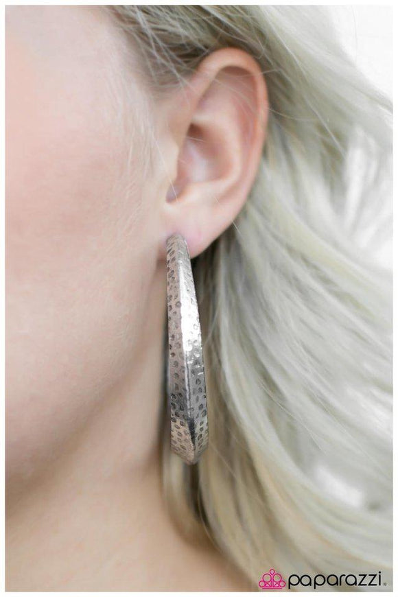 Paparazzi Jungle to Jungle- Silver A thick silver hoop creases at the center, creating a chic 3-dimensional display. Finished in a hammered surface, the antiqued design evokes an indigenous inspired style. Earring attaches to standard post fitting. Hoop measures 2 1/4