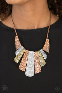Paparazzi Untamed Copper, silver and brass plates featuring various hammered and filigreed textures fan out across the chest along a thick copper snake chain. The gorgeous tribal design falls gracefully below the collar into a dramatic statement piece. Features an adjustable clasp closure.
