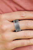 Paparazzi Roughin It - Silver
Dotted and studded in tribal inspired patterns, an antiqued silver band arcs across the finger in a handcrafted, artisan inspired fashion. Features a stretchy band for a flexible fit.
