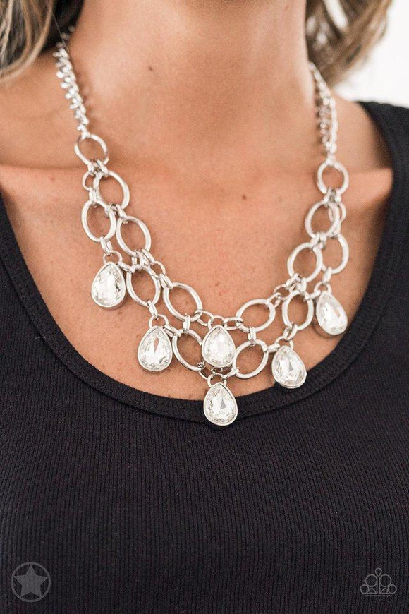 Paparazzi Show-Stopping Shimmer - White Joined by dainty silver links, two rows of dramatic silver chain layer below the collar in a fierce fashion. Glittery white teardrops drip from the glistening layers, adding a timeless shimmer to the show-stopping piece. Features an adjustable clasp closure.
