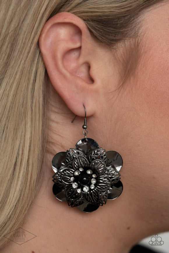 Paparazzi Midnight Garden - Black Gunmetal - Earrings  -  Sleek gunmetal petals with a variety of textures are layered to create a dramatic flower. A single black bead bordered by a ring of rhinestones anchors the design while adding unmatched sparkle. Earring attaches to a standard fishhook fitting.