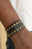Paparazzi The Wander Years - Black Glistening brass studs are pressed into a black leather band for a rustic look. Features an adjustable buckle closure.
