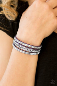 Paparazzi Unstoppable - Purple - Bracelet  -  Glassy white rhinestones and shimmery silver chains are encrusted along strands of purple suede, creating a mishmash of sassy shimmer around the wrist for a fierce look. Features an adjustable snap closure.

