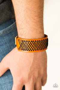 Paparazzi Cross The Line - Brown  -  Shiny black thread is stitched across the front of a brown leather band. The crisscrossing threads create a tactile pattern around the wrist. Features an adjustable buckle closure.
