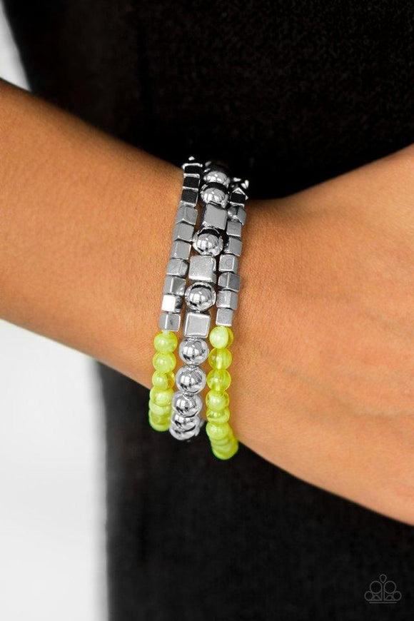 Paparazzi Take Shape - Green Classic silver, cloudy green, and silver cube beading are threaded along elastic stretchy bands, creating colorful mismatched layers across the wrist.

