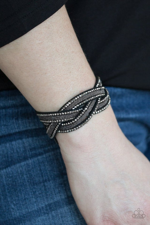 Paparazzi Girls Do It Better - Black - Bracelet  -  Dusted in glitter, skinny black strands braid with hematite rhinestone encrusted strands across the wrist for a sassy look. Features an adjustable snap closure.
