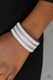 Paparazzi Dangerously Drama Queen - Purple Rows of shimmery silver chains and glassy white rhinestones are encrusted along a purple suede band. The glittery band has been spliced into three strands, creating row after row of blinding shimmer for a sassy look. Features an adjustable snap closure.

