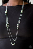 Paparazzi Spring Splash- Green Bubbly white pearls, glittery crystal-like beads, and opaque green beads are sprinkled along two shimmery silver chains for a refined look. Features an adjustable clasp closure.

