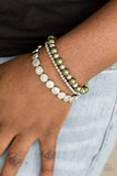 Paparazzi Girly Girl Glamour - Green Mismatched silver and pearly green beads are threaded along stretchy elastic bands, creating colorful layers across the wrist.
