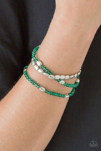 Paparazzi Hello Beautiful - Green Infused with hints of silver, dainty green crystal-like beads are threaded along stretchy bands, creating whimsical layers across the wrist.
