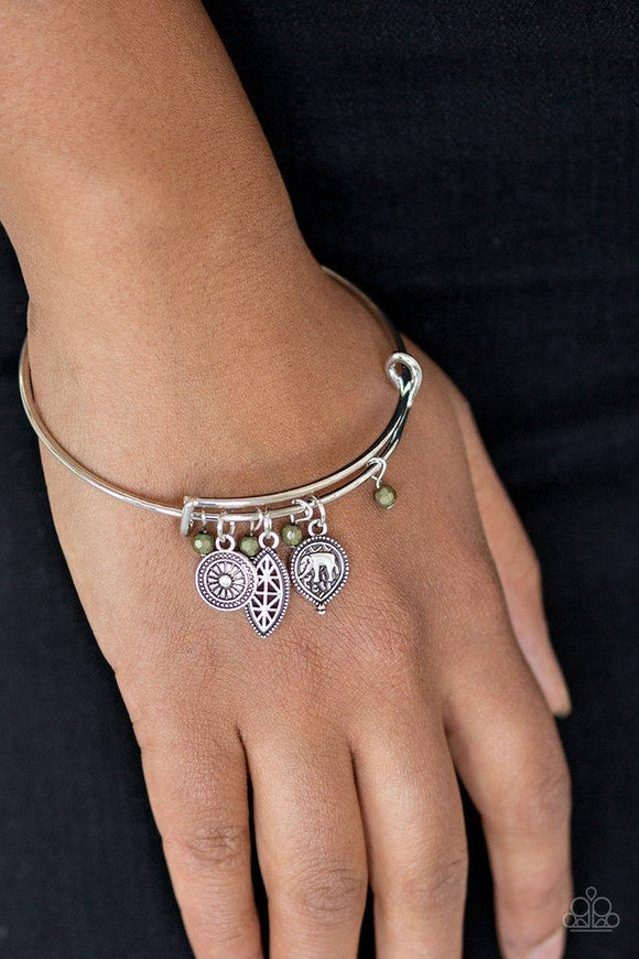 Paparazzi The Elephant In The Room - Green Dainty Martini Olive beads and an array of silver charms featuring elephant and floral patterns slide along a sleek bar fitting for a whimsical look.

