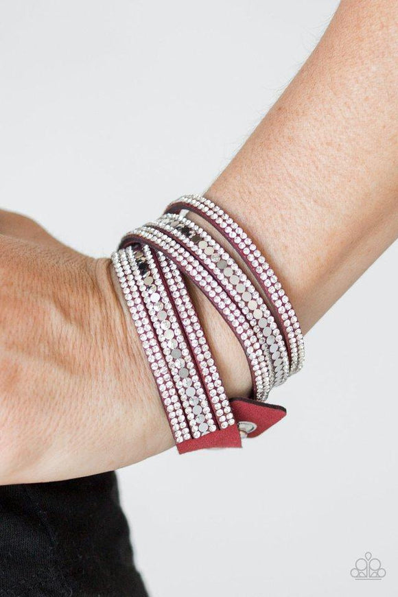 Paparazzi Rock Star Attitude - Red Encrusted in rows of glassy white rhinestones and flat silver studs, three strands of red suede wrap around the wrist for a sassy look. The elongated band allows for a trendy double wrap around the wrist. Features an adjustable snap closure.

