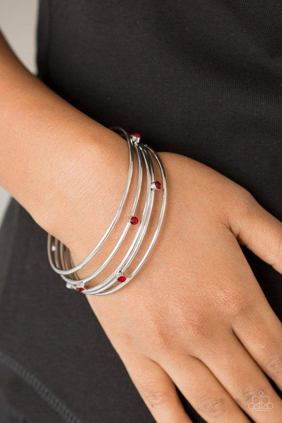 Paparazzi Delicate Decadence - Red  -  Three shiny silver and two red rhinestone encrusted bangles stack across the wrist for a refined look.
