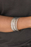 Paparazzi Basic Blend - Silver  -  Featuring smooth and twisted surfaces, mismatched silver bangles stack across the wrist for a casual look.
