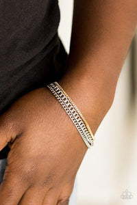 Paparazzi Industrial Icon - Silver  -  Dainty gold box chain and mismatched silver chains layer across the wrist, creating a collision of industrial textures. Features an adjustable clasp closure.

