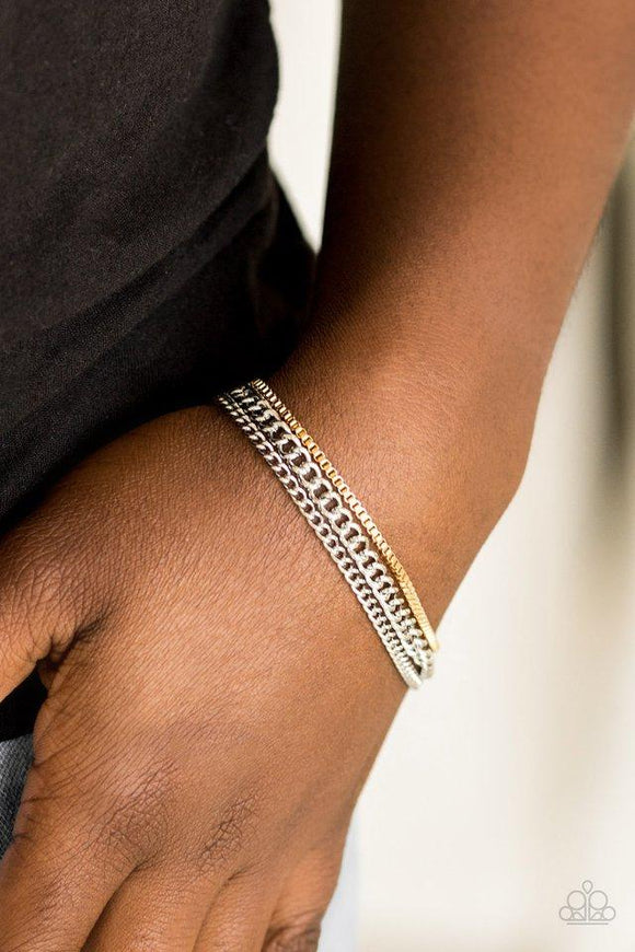 Paparazzi Industrial Icon - Silver  -  Dainty gold box chain and mismatched silver chains layer across the wrist, creating a collision of industrial textures. Features an adjustable clasp closure.

