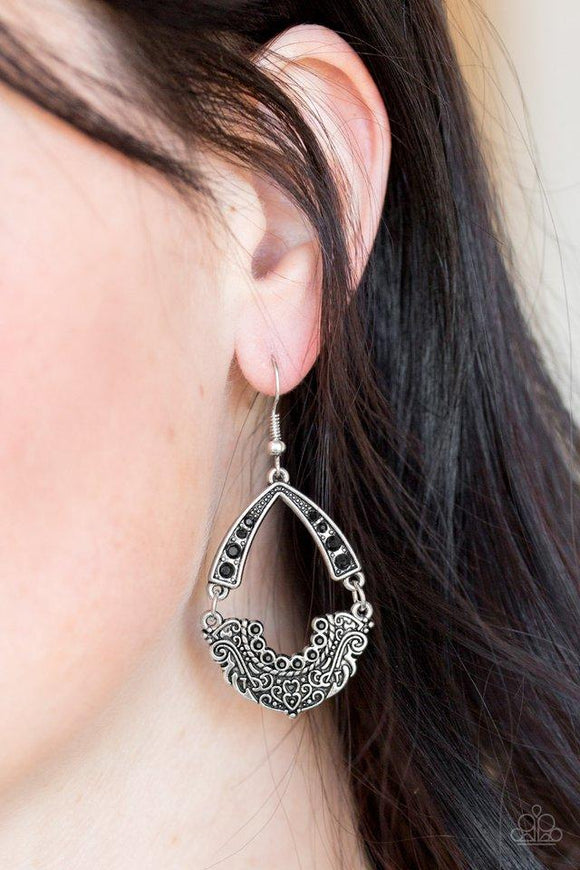 Paparazzi Royal Engagement - Black Encrusted in dazzling black rhinestones, an arcing silver frame links with an ornate silver frame radiating with filigree filled details for a refined look. Earring attaches to a standard fishhook fitting.

