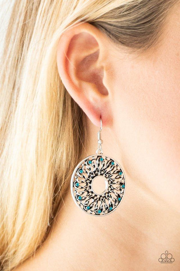 Paparazzi Malibu Musical - Blue Dotted in dainty blue rhinestones, glistening silver wires twist and interlock inside of a shimmery silver hoop for a whimsical look. Earring attaches to a standard fishhook fitting.

