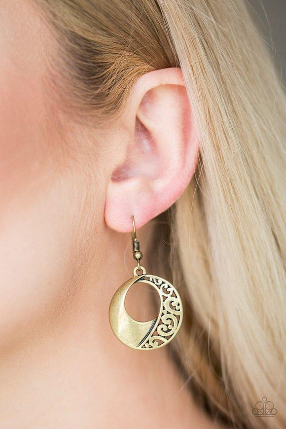 Paparazzi Eastside Excursionist - Brass  -  Glistening brass filigree joins with an antiqued brass frame, coalescing into a whimsical lure. Earring attaches to a standard fishhook fitting.
