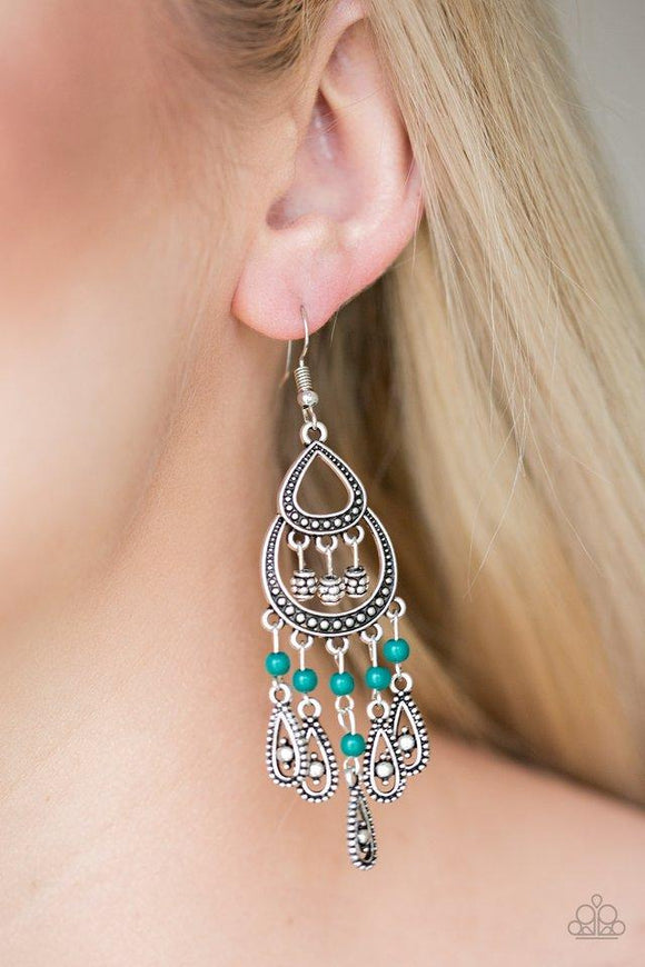 Paparazzi Eastern Excursion - Green Dotted with refreshing green beading, ornate silver teardrop frames swing from the bottom of a studded silver frame, creating a whimsical fringe. Earring attaches to a standard fishhook fitting.

