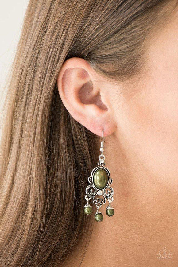 Paparazzi I Better Get GLOWING - Green Dotted silver filigree spins around a pearly green bead and dainty white rhinestones, coalescing into a regal frame. A pearly fringe swings from the bottom of the frame for a refined finish. Earring attaches to a standard fishhook fitting.
