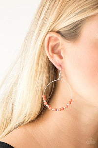 Paparazzi Stone Spa - Orange Dainty silver beads and refreshing orange stone beads slide along a dainty silver hoop for a seasonal look. Earring attaches to a standard fishhook fitting.

