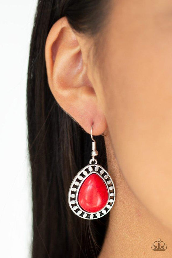 Paparazzi Sahara Serenity - Red Chiseled into a tranquil teardrop, a smooth red stone is pressed into a shimmery silver frame radiating with tribal inspired textures for a seasonal look. Earring attaches to a standard fishhook fitting.

