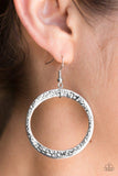 Paparazzi Wildly Wild Lust- Silver Delicately hammered in light-catching detail, an asymmetrical silver hoop swings from the ear for an artisan inspired look. Earring attaches to a standard fishhook fitting.

