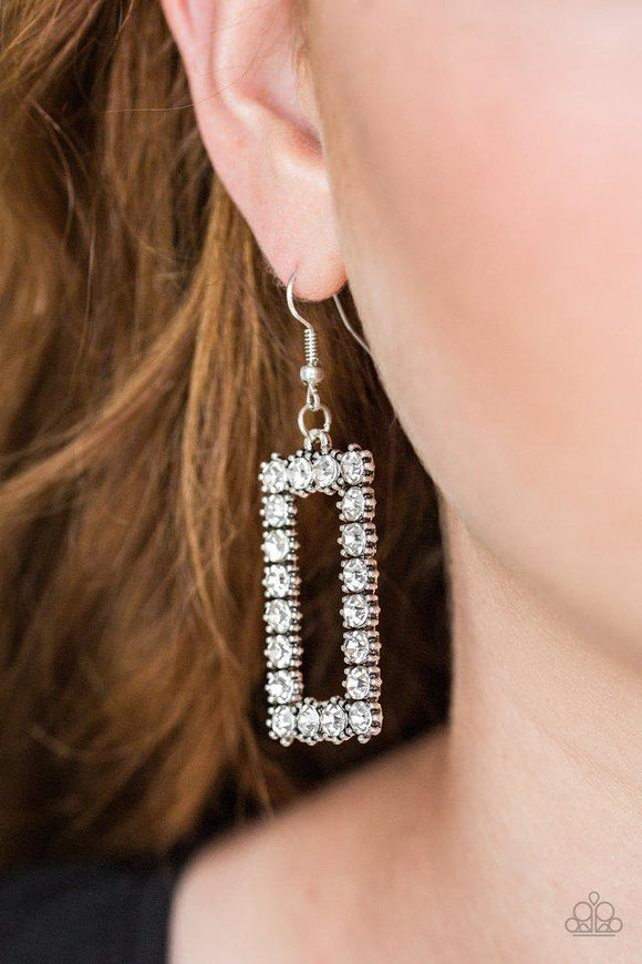 Paparazzi Mirror, Mirror - White  -  Glittery white rhinestones are encrusted along a silver rectangular frame, creating a glamorous lure. Earring attaches to a standard fishhook fitting.
