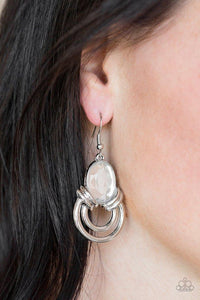 Paparazzi Real Queen - White Shimmery silver hoops radiate from the bottom of a dramatic white gem fitting, coalescing into a regal frame. Earring attaches to a standard fishhook fitting.

