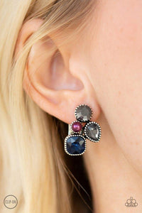 Paparazzi Super Superstar - Multi Infused with a dainty purple pearl, mismatched blue, smoky, and hematite rhinestones coalesce into a glittery frame. Earring attaches to a standard clip-on fitting.
