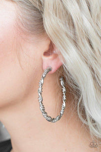 Paparazzi Street Mod - Silver Glistening silver bars wrap into an edgy twisted hoop for a casual look. Earring attaches to a standard post fitting. Hoop measures 2" in diameter.
