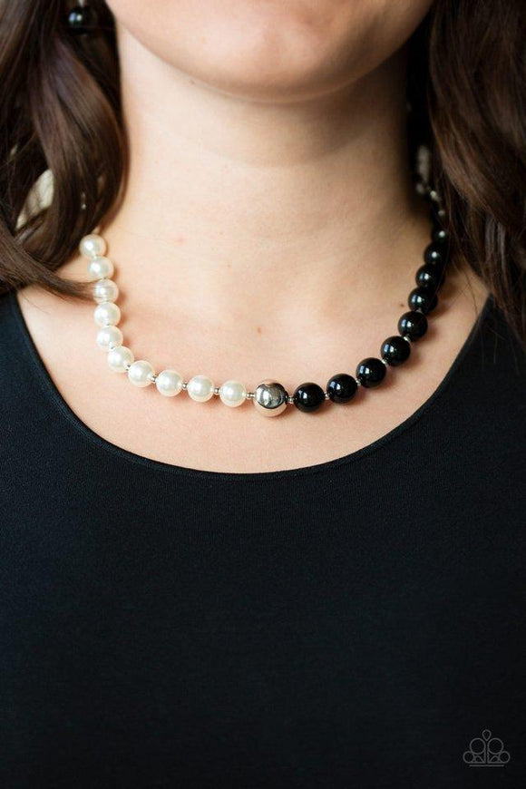 Paparazzi 5th Avenue A-Lister - BlackSeparated by dainty silver beads, classic white pearls merge into shiny black beads for a contemporary look. Infused with a shiny silver bead, the timeless pearls and beads collect below the collar for a refined asymmetrical look. Features an adjustable clasp closure.
