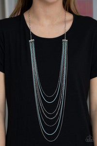 Paparazzi Radical Rainbows - Blue  -  Mismatched silver chains alternate with dainty blue chains down the chest, creating a colorful industrial look. Features an adjustable clasp closure.
