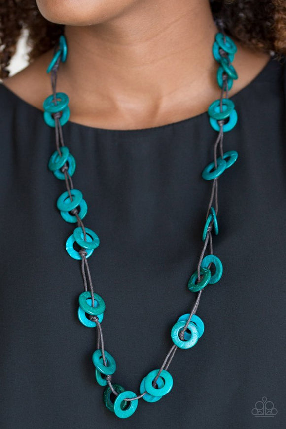 Paparazzi Waikiki Winds - Blue - Necklace  -  Shiny brown cording knots around refreshing blue wooden discs, creating a colorful display across the chest. Features a button loop closure.
