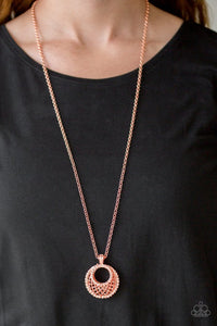 Paparazzi Net Worth - Copper - Necklace  -  Featuring a shiny copper net-like pattern, a peach rhinestone encrusted crescent shaped frame swings from the bottom of a lengthened shiny copper chain, creating a refined 3-dimensional pendant. Features an adjustable clasp closure.
