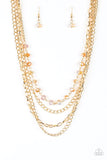 Paparazzi Extravagant Elegance - Gold - Necklace  -  Mismatched gold chains layer down the chest. A strand of gold dusted gems join below the collar for a glamorous look. Features an adjustable clasp closure.
