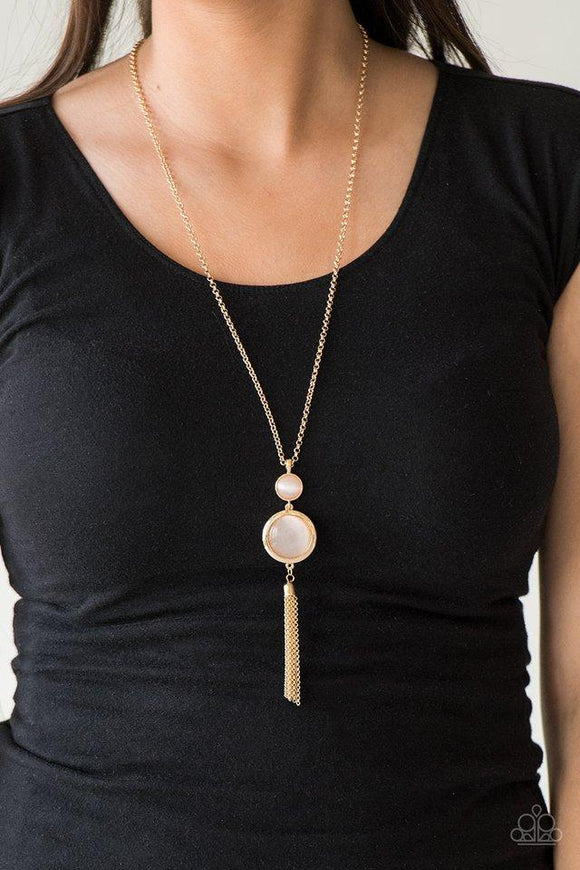 Paparazzi Have Some Common SENSEI - Gold Swinging from the bottom of a glistening gold chain, glowing stacked moonstone pendants give way to a shimmery gold tassel for a refined look. Features an adjustable clasp closure.

