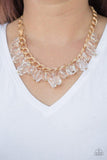 Paparazzi Gorgeously Globetrotter - White Varying in shape and shimmer, smooth and faceted glassy beads trickle from doubled gold chain links, creating a glamorous fringe below the collar. Features an adjustable clasp closure.

